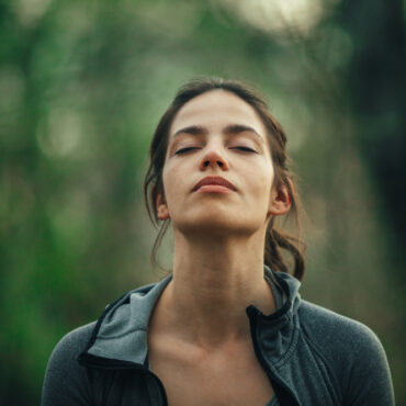 Young beautiful woman exercise in the forest